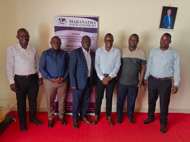 Church leaders standing together at a Maranatha Faith Restoration Ministries event